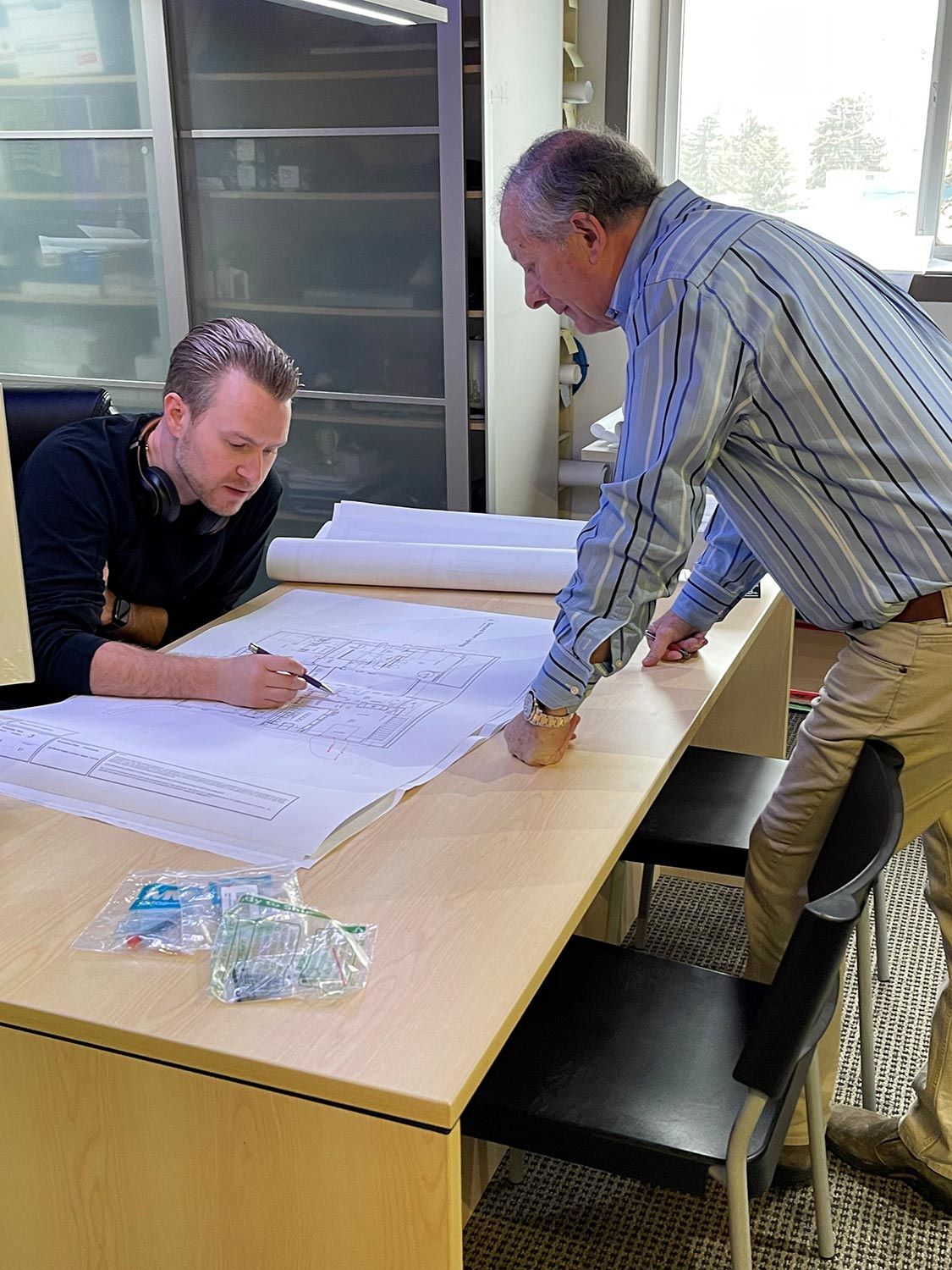 People working on design plans